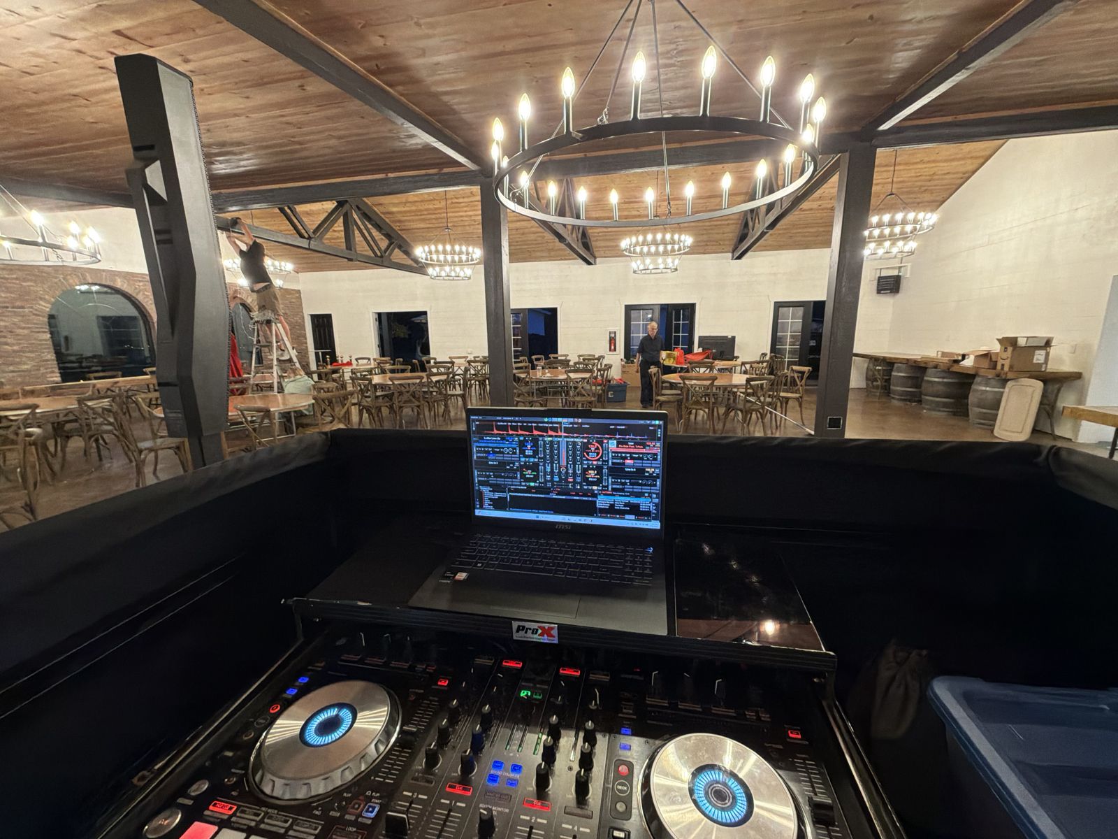 Apogee DJ controller and laptop set up in the chandelier-lit reception room at Gardens at Riverside in Albany, Oregon