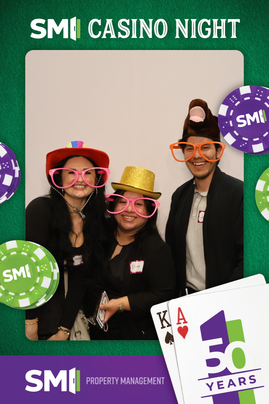 Casino-night photo booth print, three guests in oversized glasses and party hats on a poker-chip template