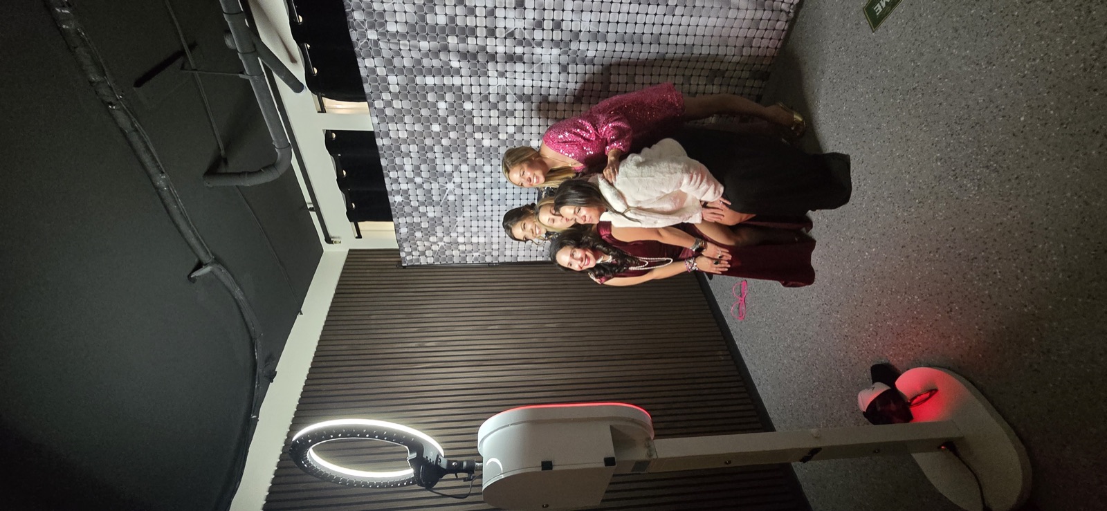 The Queen photo booth at Cellar 54 in Salem with a silver sequin backdrop