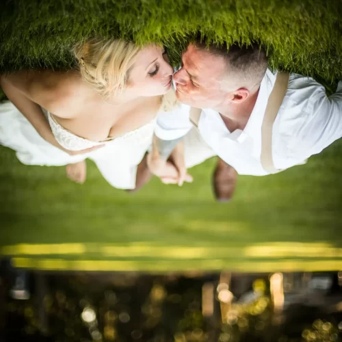 Capturing the love between wedding couples in green yard