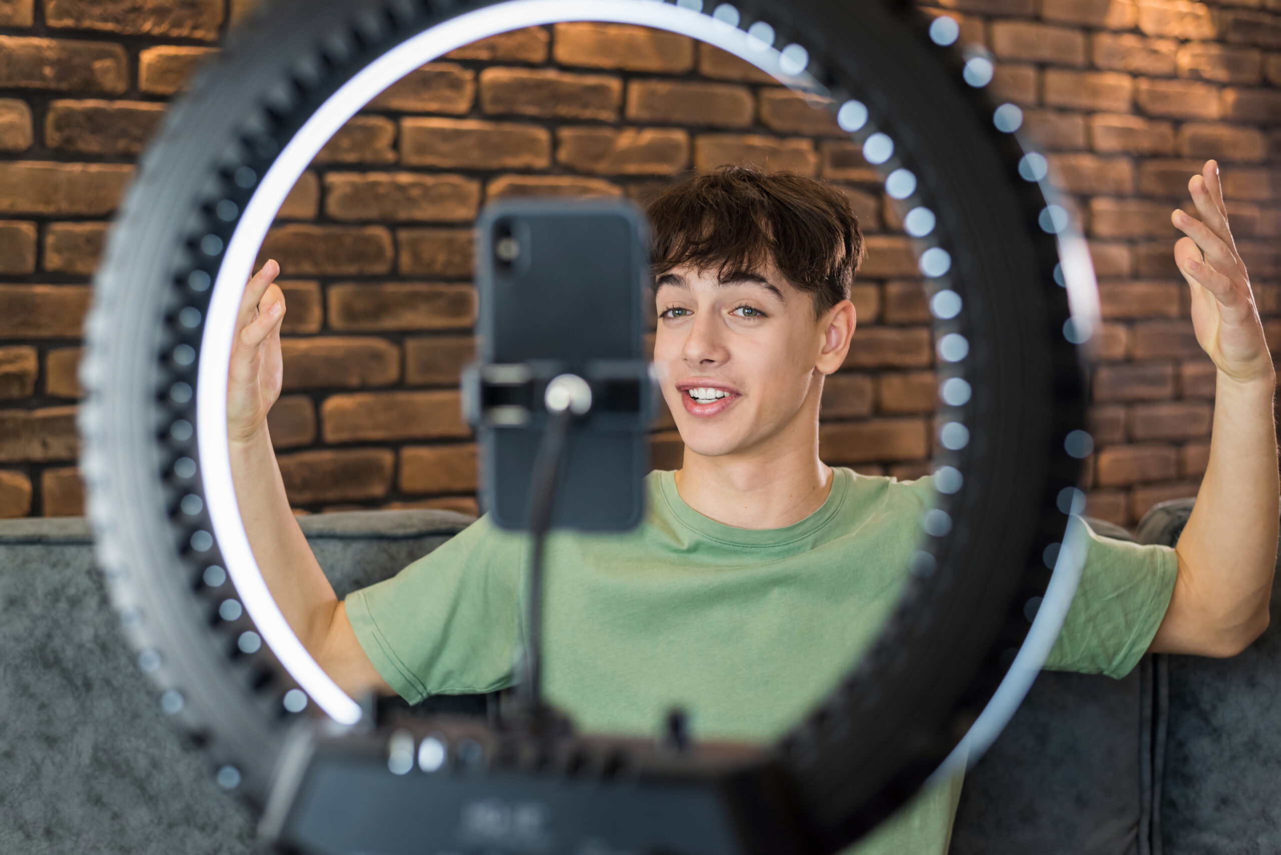 A young smiling man using 360 Photo Booth to Your Event