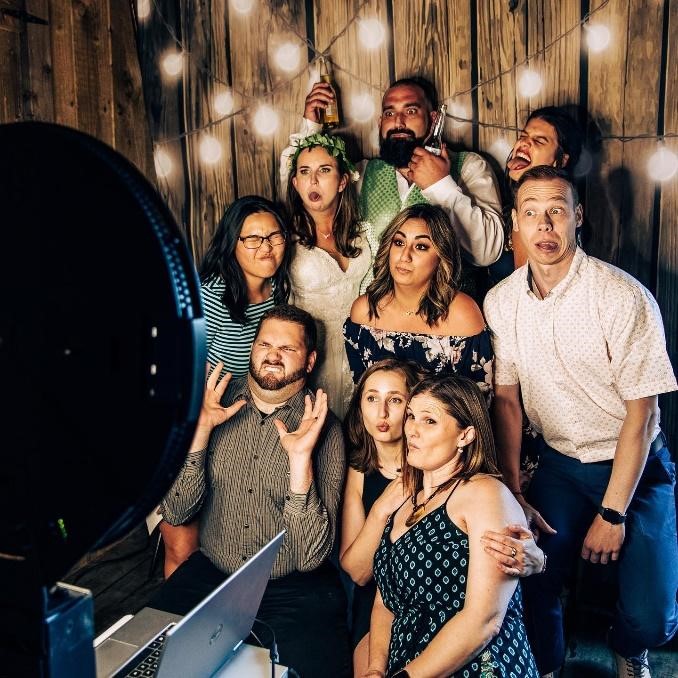 People enjoying the Photo booth experience in the wedding event