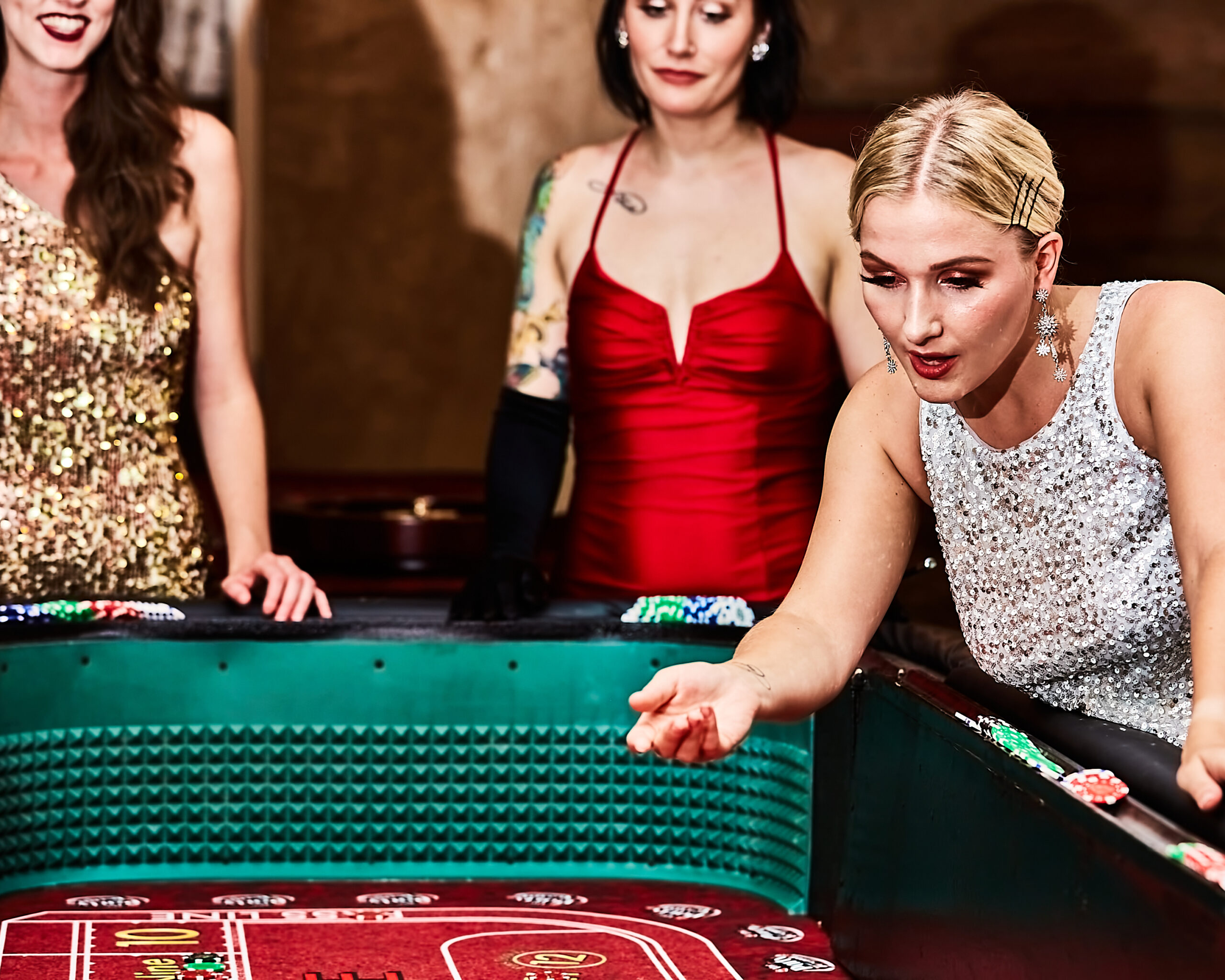 Guests playing poker at Apogee casino party