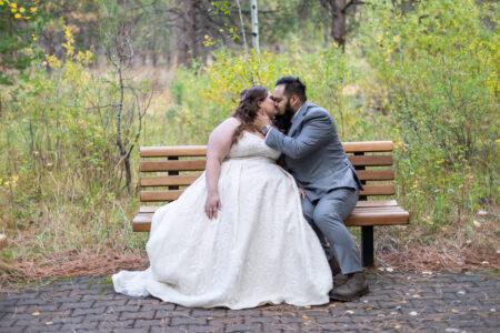 A couple kisses on a bench in Salem Oregon