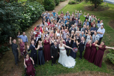 Overhead aerial group photo of bride groom and all wedding guests at Oregon vineyard wedding